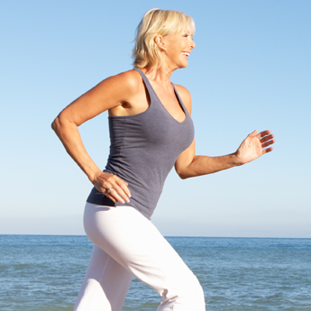 Woman Running On the Beach